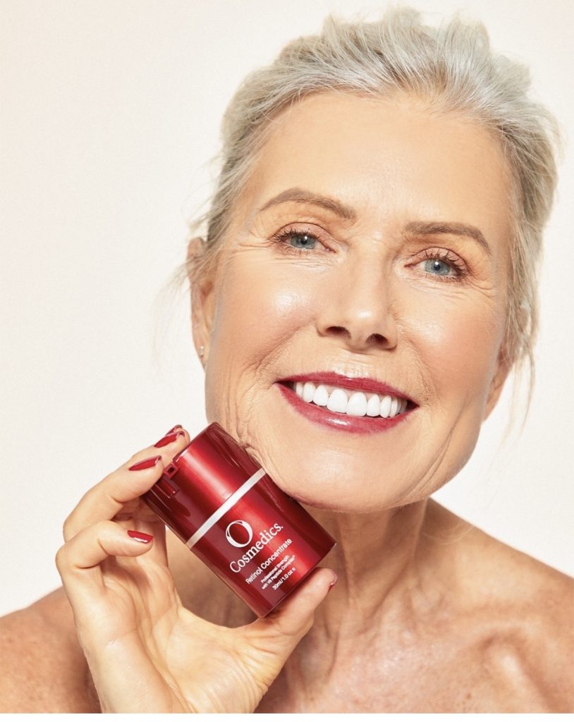 Old woman holding O Cosmedics Anti Aging Cream