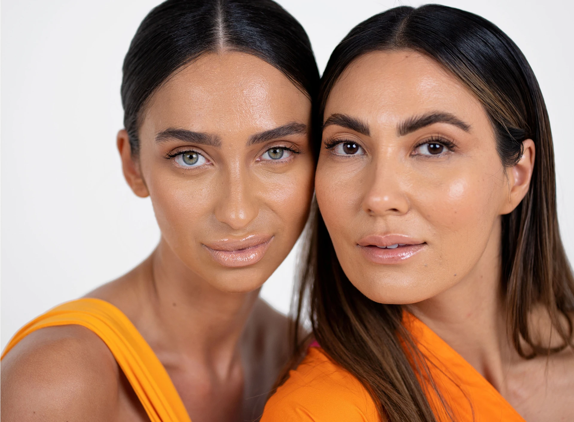 1SKin makeup models wearing treatment foundation and Lotus primer