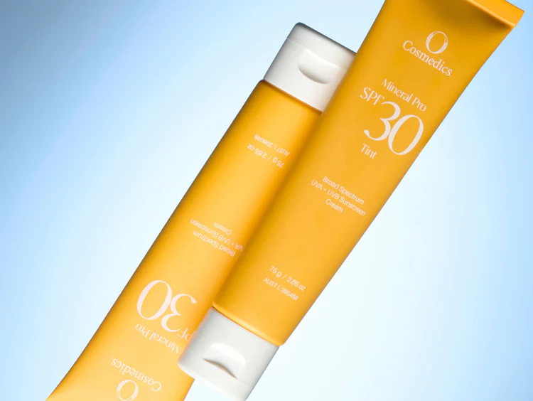spf-30-with-light-blue-background 2 tubes of Mineral SPF with light blue backdrop