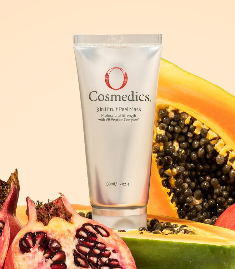 3-in-1 Fruite Peel Mask Product surrounded by papaya and other fruits